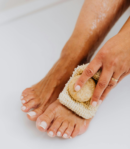 Person washing their feet